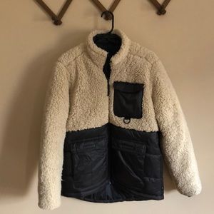 Cream Sherpa and black puffy coat